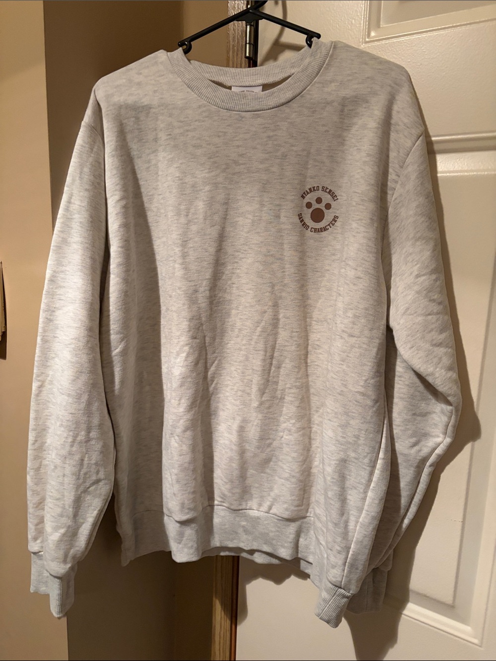 Sanrio Light Gray Crewneck Sweatshirt with Small Chest Paw Logo